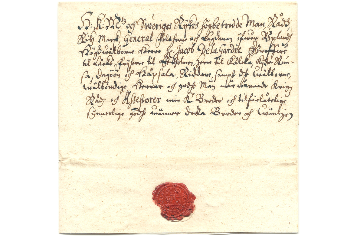 Vanha kirje jossa vanhaa käsialaa ja punainen sinetti.